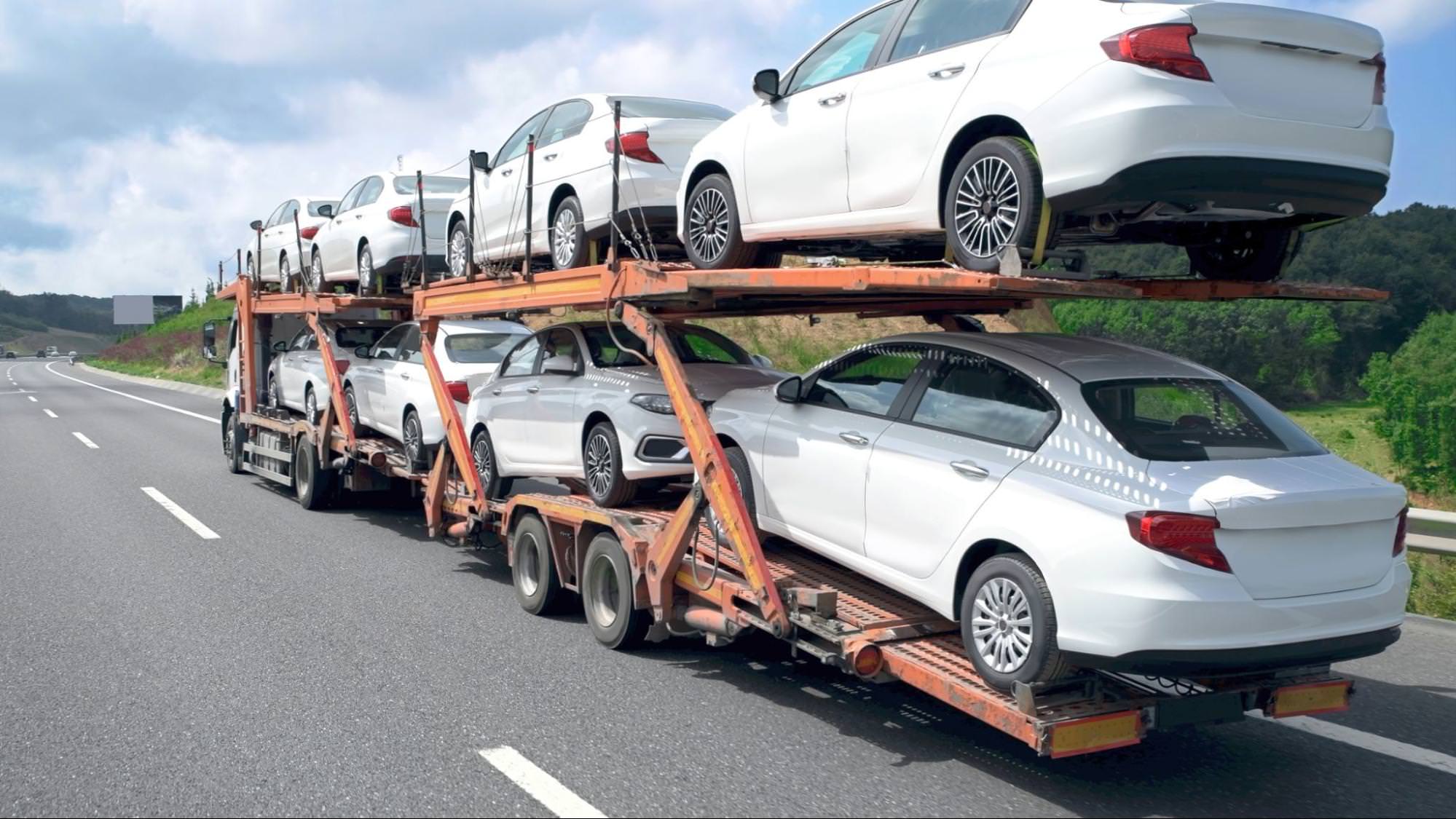a car carrier with cars on it